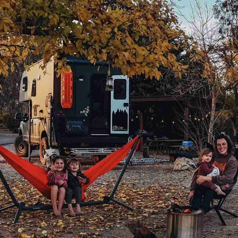 Black Forest Adventure Board on the rear door of a rugged travel trailer